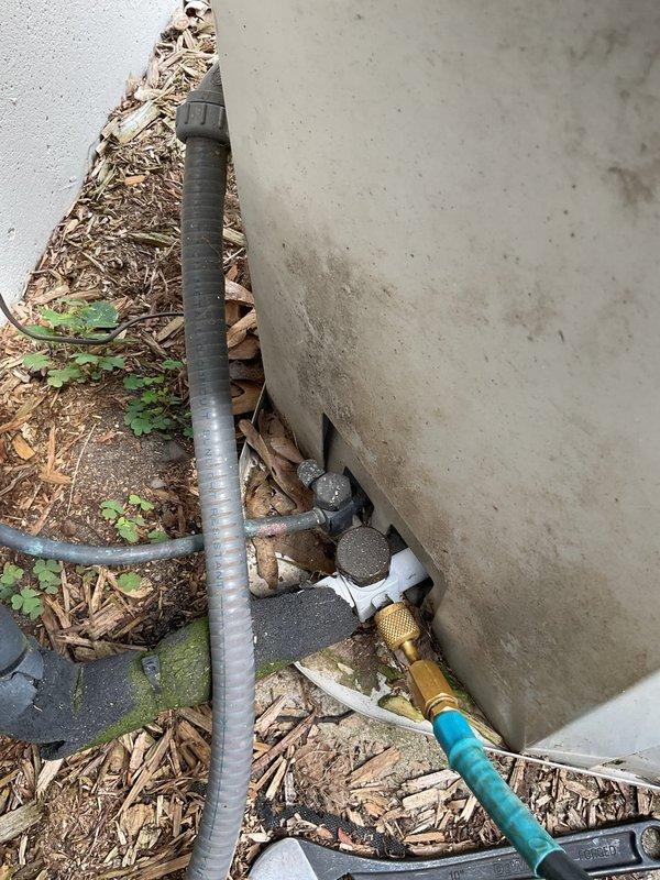 Responded to no cooling complaint on approximately 20-year-old residential air conditioning system. Upon arrival, performed visual inspection of outdoor condenser unit, which showed significant age-related deterioration including rust, corrosion, and weather damage throughout the cabinet and fan grille. Assessed electrical connections and refrigerant line set configuration at service ports. Documented existing conditions of aged equipment and outdoor installation environment. Unit's advanced age and extensive wear indicate system is well beyond typical service life expectancy.
