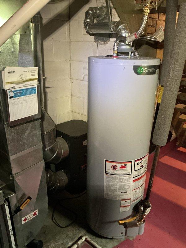 Responded to no-cooling complaint on residential split system installed in 2020. Upon arrival, confirmed air handler was operating but system was not producing cool air throughout the home. Performed diagnostic assessment of Goodman furnace and evaporator coil assembly located in basement utility area. Inspected refrigerant lines, electrical connections, and condensate drainage system. Verified blower operation and airflow through ductwork. Documented equipment condition and system configuration with photos for service records. System requires further evaluation of outdoor condensing unit and refrigerant charge levels to determine root cause of cooling failure and complete necessary repairs.