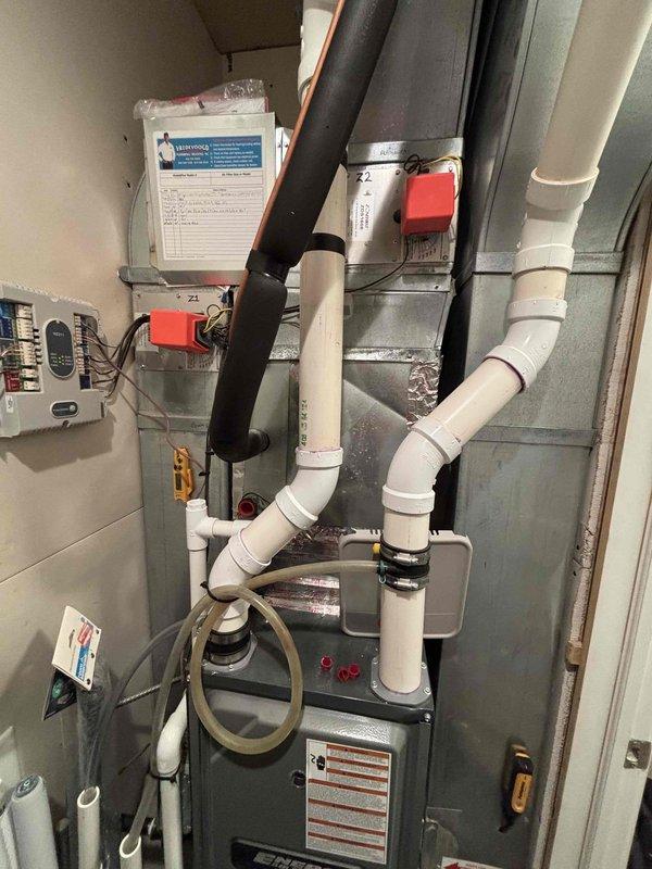 Responded to callback for zoned air conditioning system with cold air discharging into incorrect zone after previous repair attempt. Inspected 12-year-old Payne zoned HVAC system and identified malfunctioning zone damper motor assembly. Found Zone 2 damper actuator failing to maintain proper position, causing airflow to redirect after initial cycling. Verified damper motor wiring connections, tested actuator operation through multiple cycles, and confirmed proper zone control board signaling. Corrected damper linkage positioning and secured all electrical connections at zone control panel. Cycled system through all zone calls to verify proper damper operation and airflow distribution to designated areas. System now operating correctly with airflow directing to appropriate zones as called for by respective thermostats.