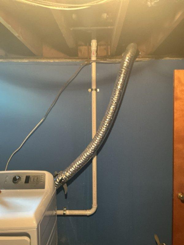 Responded to kitchen sink drain clog in utility/laundry area. Accessed plumbing system through crawl space opening to inspect and clear blockage in PVC drain line. Successfully restored proper drainage function and verified system operation.
