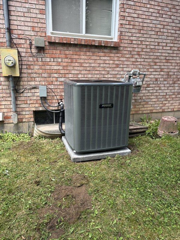 Completed full HVAC system replacement including outdoor condenser unit and indoor air handler. Installed new condenser on existing concrete pad with proper refrigerant line routing secured to exterior brick wall, connected to electrical service with appropriate disconnect and metering. Replaced indoor furnace/air handler unit in basement with new equipment, installed metallic supply ductwork with proper connections to existing distribution system, and verified gas line connections and electrical hookups. System tested and operational upon completion.