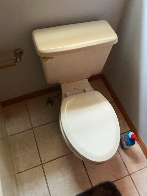 Conducted on-site assessment for complete bathroom remodel and gut project. Documented existing plumbing fixtures including undermount vanity sink with brushed nickel two-handle faucet, standard white porcelain toilet, and evaluated current tile flooring and vanity cabinet condition for full replacement planning.