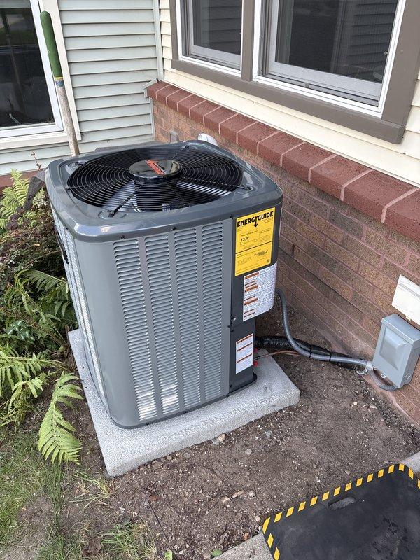Completed full installation of new residential HVAC system including furnace and air conditioning condenser unit. Installed outdoor AC unit on concrete pad with proper electrical disconnect and conduit routing through exterior wall. Set refrigerant charge to manufacturer specifications with factory charge of 68 oz and zero field charge required for total system charge of 68 oz. Verified all refrigerant lines properly insulated and secured, with service valves and access ports installed per code. System utilizes A2L refrigerant safety classification. Confirmed unit properly mounted on pad with adequate clearance from foundation and verified electrical connections secure at disconnect box. Installation completed with all components operational and system ready for service.