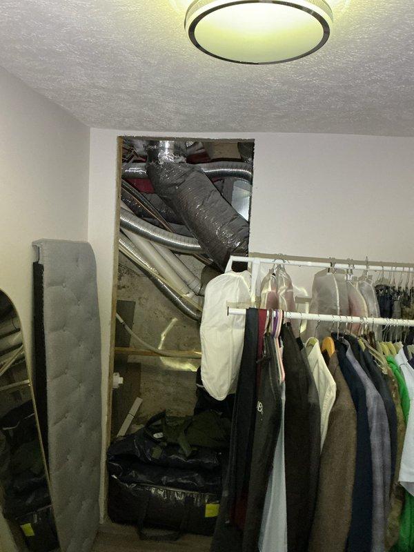 Responded to plumbing leak involving hot water circulation system. Upon inspection, identified leak at circulation pump and associated piping connections near water heater in utility closet. Accessed mechanical space through closet area where HVAC ductwork and plumbing systems are located. Examined water heater installation with PEX supply lines (red hot, blue cold, white circulation) and circulation pump mounted on piping system. Tightened fittings at pump connections and galvanized pipe joints where leak was occurring. Verified all connections at water heater top including brass fittings and metallic elbow joints for proper seal. Tested system operation and confirmed no active leaks present. Hot water circulation restored to normal function throughout home.
