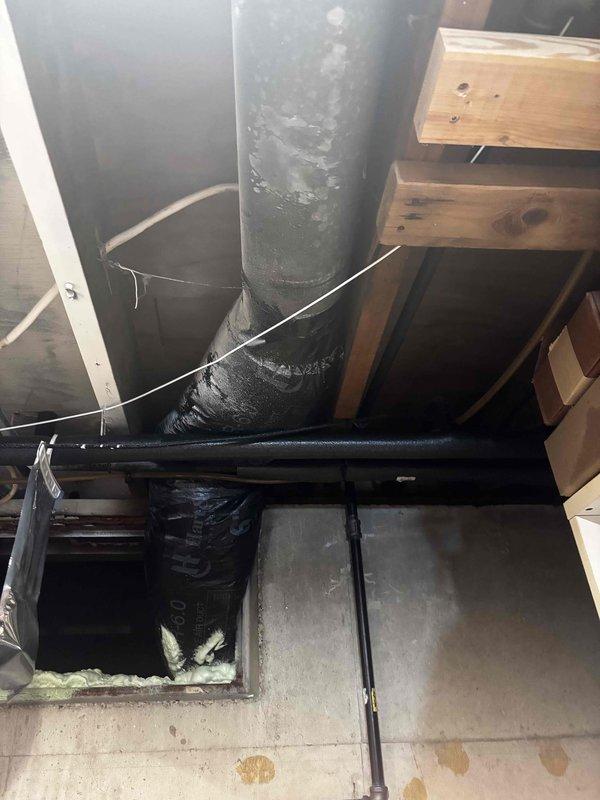 Completed annual cooling maintenance inspection on residential HVAC system. Addressed customer concern regarding drooping vent section in basement area. Upon inspection, identified significant condensation accumulation on main supply duct, indicating potential insulation deficiency or humidity control issues. Documented moisture buildup with photographs for customer records. Performed standard tune-up procedures including filter inspection, electrical connection verification, and system operational check. Recommended monitoring condensation issue and considering duct insulation upgrade to prevent ongoing moisture problems and improve system efficiency.