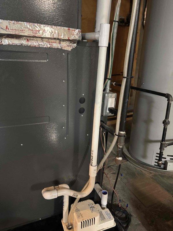 Responded to water leak call caused by failed AC condensate pump at HVAC system. Replaced malfunctioning condensate pump to restore proper drainage from air handler unit. Verified leak sensor operation and confirmed system draining correctly with no further water accumulation.