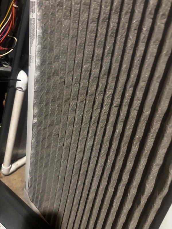Responded to no-cool service call on 15-year-old residential AC unit that would not power on. Customer suspected thermostat wiring issue. Upon arrival, performed system diagnostics and visual inspection of both indoor and outdoor components. Documented heavily soiled evaporator coil with significant dust and debris accumulation on aluminum fins, restricting airflow and reducing heat transfer efficiency. Traced electrical connections from thermostat through control board to verify wiring integrity and proper voltage. Identified failed control board preventing unit from receiving thermostat signal. Replaced defective control board and restored proper electrical communication between thermostat and system. Tested all safety switches, contactors, and electrical connections for proper operation. Cycled system through complete startup sequence, confirmed compressor engagement, verified proper amperage draw, and ensured adequate airflow through supply registers. Recommended immediate evaporat