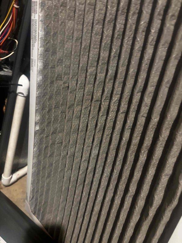 Responded to no-cool service call on 15-year-old residential AC unit that would not power on. Customer suspected thermostat wiring issue. Upon arrival, performed system diagnostics and visual inspection of both indoor and outdoor components. Documented heavily soiled evaporator coil with significant dust and debris accumulation on aluminum fins, restricting airflow and reducing heat transfer efficiency. Traced electrical connections from thermostat through control board to verify wiring integrity and proper voltage. Identified failed control board preventing unit from receiving thermostat signal. Replaced defective control board and restored proper electrical communication between thermostat and system. Tested all safety switches, contactors, and electrical connections for proper operation. Cycled system through complete startup sequence, confirmed compressor engagement, verified proper amperage draw, and ensured adequate airflow through supply registers. Recommended immediate evaporat