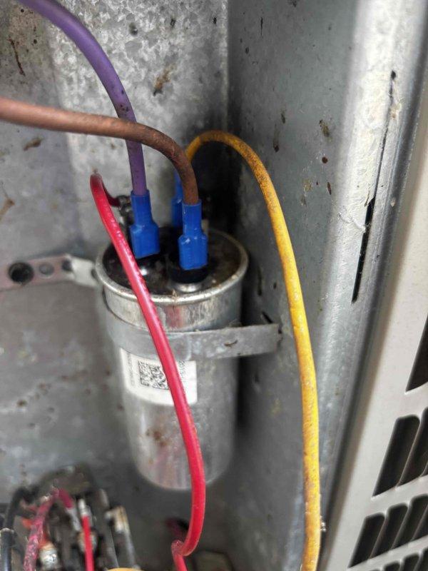 # CP-Cooling Problem

Responded to cooling system not maintaining set point temperature. Upon inspection, discovered severely corroded and burned wiring connected to the compressor capacitor, which was causing electrical failure and preventing proper system operation. Replaced damaged wiring and tested capacitor connections to restore full functionality. System now operating properly and maintaining desired temperature set point.