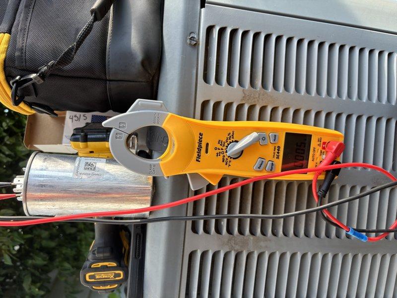 Completed annual cooling maintenance on 8-year-old EnergiAir system. Performed comprehensive tune-up including electrical diagnostics with clamp meter, tested and verified capacitor operation (45/5 MFD dual run capacitor), inspected outdoor condensing unit, and serviced indoor air handler with condensate drainage system. Replaced wireless thermostat batteries per maintenance protocol.