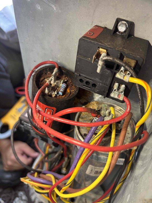 Completed annual cooling maintenance on 9-year-old EnergiAir system under warranty through October 2026. Inspected electrical components including contactor and capacitor assembly; documented heavily corroded capacitor with rust deterioration on metal casing and signs of aging on contactor unit. Verified all electrical connections, checked voltage readings at 245V capacitor, and captured photographic documentation of component conditions for warranty records.