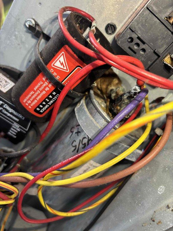 Completed annual cooling maintenance on 9-year-old EnergiAir system under warranty through October 2026. Inspected electrical components including contactor and capacitor assembly; documented heavily corroded capacitor with rust deterioration on metal casing and signs of aging on contactor unit. Verified all electrical connections, checked voltage readings at 245V capacitor, and captured photographic documentation of component conditions for warranty records.