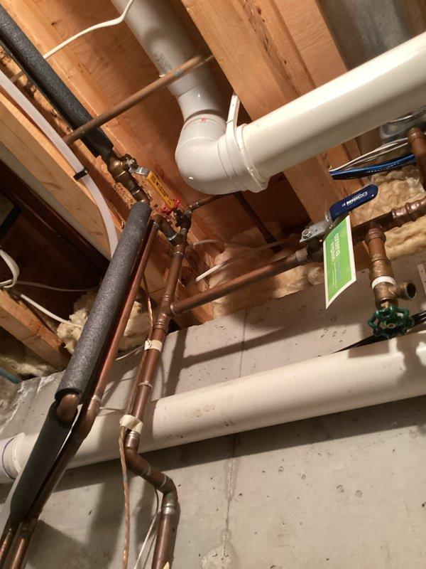 Responded to service call for two leaking outdoor spigots. Upon inspection, accessed basement plumbing infrastructure and located supply lines feeding exterior hose bibs. Identified worn valve components causing leaks at both outdoor faucet locations. Shut off water supply using existing shutoff valves, repaired faulty connections, and verified proper operation. Consulted with client on replacement faucet options, presenting modern pull-down kitchen faucet with brushed metal finish as potential upgrade for future consideration. Tested both outdoor spigots post-repair to confirm leaks were eliminated and full water pressure restored.