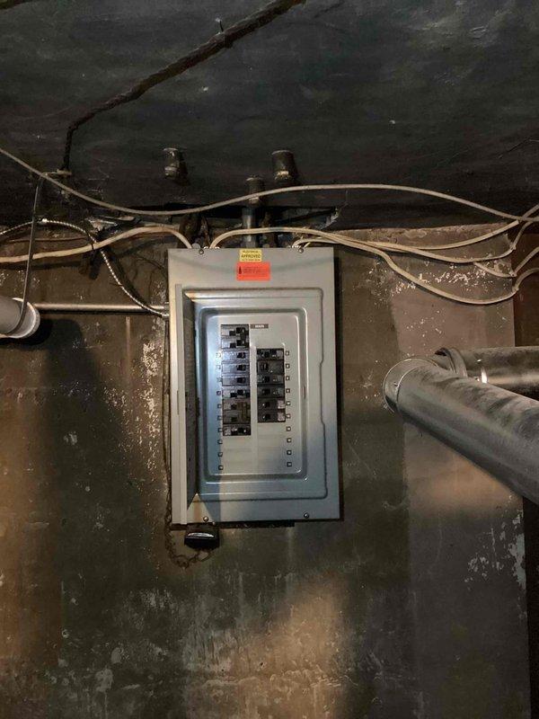 Completed on-site estimate for adding air conditioning system to residential property. Conducted thorough inspection and documentation of existing electrical infrastructure, including main service panel and circuit breaker configuration. Evaluated electrical capacity and panel conditions to determine compatibility with proposed AC installation, photographing panel layout, available breaker spaces, and incoming service wiring for system design and load calculation purposes.