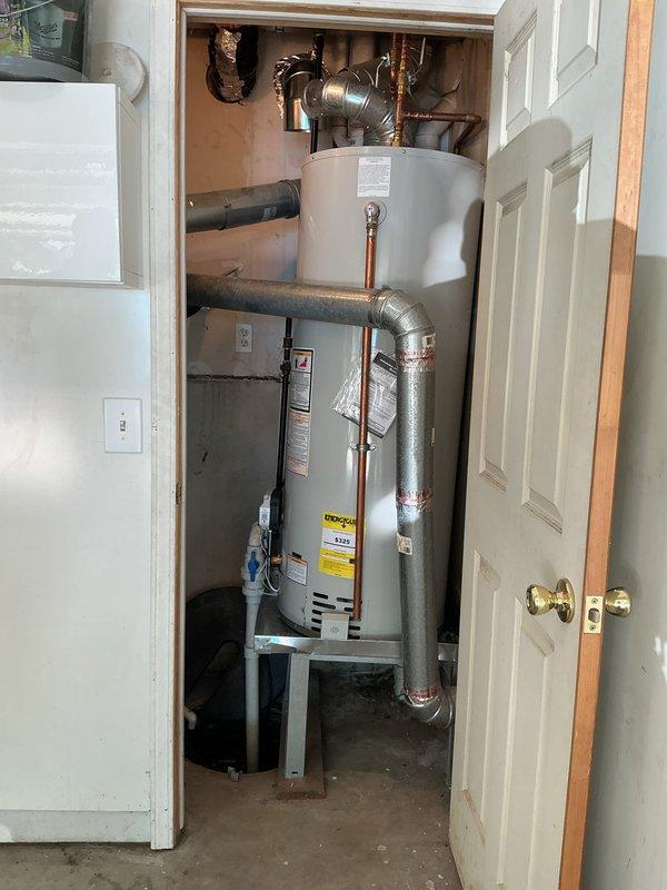 Responded to inspection correction notice regarding inadequate combustion air for water heater located in confined utility closet. Assessed existing ventilation configuration and determined combustion air supply was insufficient per code requirements for gas-fired appliance operation. Installed proper combustion air openings and verified adequate airflow to support safe combustion and prevent potential hazardous conditions in enclosed mechanical space.
