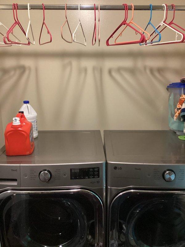 Provided estimate for relocating or installing new plumbing supply and drain lines for laundry appliances. Assessed existing LG front-loading washer and dryer configuration and evaluated dishwasher plumbing connections including water supply lines with shut-off valves and drainage system components to determine scope of work required for laundry room plumbing modifications.