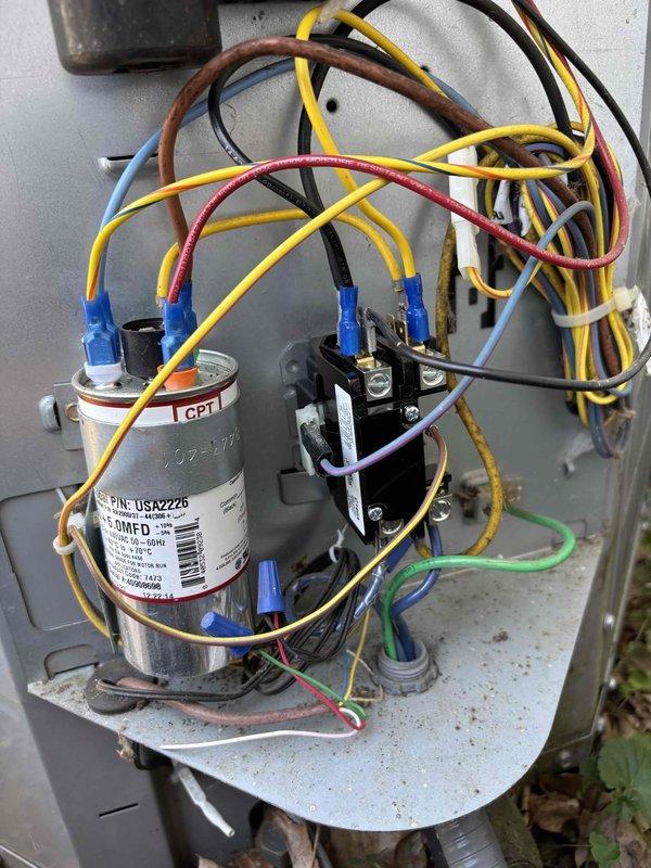 Responded to no cooling complaint on 12-year-old Carrier air conditioning system. Upon arrival, performed diagnostic evaluation of outdoor condensing unit. Identified failed dual run capacitor preventing compressor and condenser fan motor operation. Capacitor tested out of specification on both common and fan terminals. Replaced defective capacitor with properly rated OEM equivalent component. Verified all electrical connections secure and properly terminated. Tested system operation through complete cooling cycle. Confirmed compressor startup, proper amperage draw, and condenser fan motor function. System restored to normal cooling operation with appropriate temperature split across evaporator coil.