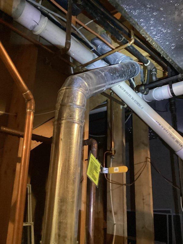 # Water Heater Leak Repair

Responded to service call for water leaking from top of 25-year-old Bradford White water heater. Upon arrival, inspected the unit and confirmed active leak originating from upper connections. Given the age of the equipment and extent of deterioration, recommended complete water heater replacement. Documented existing installation conditions including plumbing connections, venting configuration, and surrounding mechanical systems. Photographed the water heater, adjacent furnace, exposed framing, and associated piping infrastructure including copper supply lines, PVC drainage, and flexible metallic ductwork in the unfinished basement utility area. Provided customer with assessment and replacement options for aging water heater system.