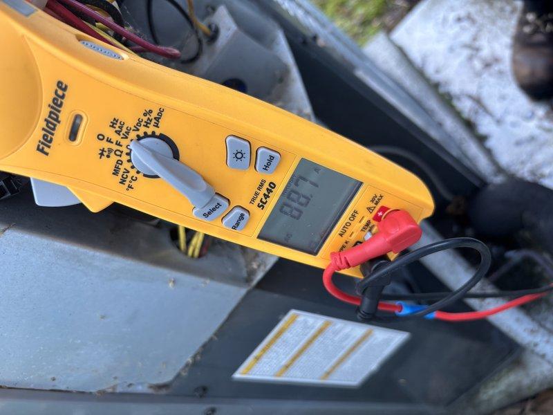 Completed annual cooling maintenance on 2018 EnergiAir system under 7-year warranty coverage. Performed comprehensive tune-up including electrical diagnostics with clamp meter, verified capacitor operation and connections, tested all electrical components and terminals, and documented system condition with photos. All wiring connections secure, capacitor functioning within specifications, and unit operating properly with no issues identified.