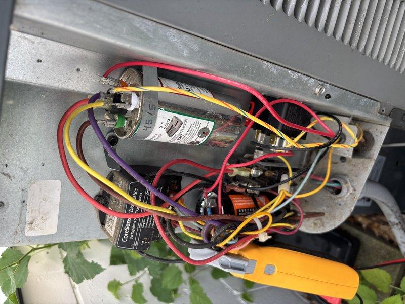 Completed annual cooling maintenance on 2018 EnergiAir system under 7-year warranty coverage. Performed comprehensive tune-up including electrical diagnostics with clamp meter, verified capacitor operation and connections, tested all electrical components and terminals, and documented system condition with photos. All wiring connections secure, capacitor functioning within specifications, and unit operating properly with no issues identified.