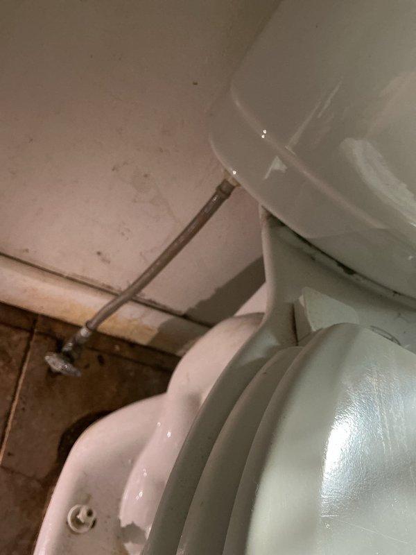 Responded to a service call for two separate toilet issues in the residence. Inspected both fixtures and identified minor plumbing problems requiring attention. Removed tank lid from one toilet to access and evaluate internal fill valve mechanism and flush components. Documented conditions with photos showing mineral buildup and component wear. Provided customer with repair options and membership program information for ongoing plumbing maintenance needs.