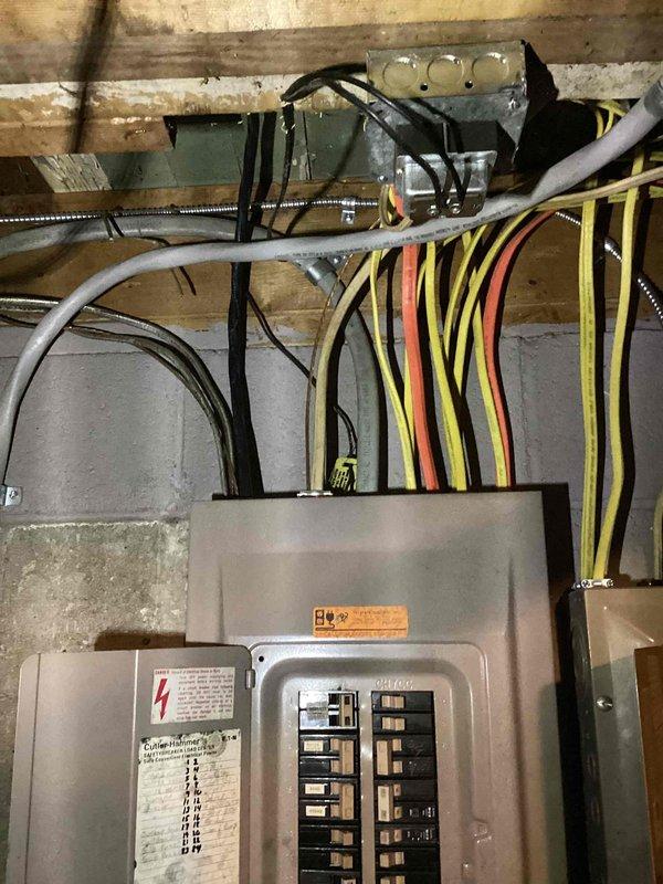 Completed sales estimate for ductless mini-split air conditioning system installation in residential property currently without cooling. Assessed electrical service panel capacity and routing requirements for multi-zone system consisting of three to four indoor air handlers serving two bedrooms, living room, and potentially basement area. Documented existing electrical infrastructure including main breaker panel configuration, available circuit capacity, and conduit pathways to determine installation feasibility and equipment specifications for proposed ductless heat pump system.