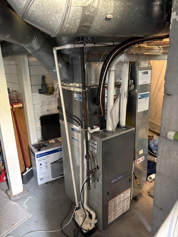 Completed full air conditioning system replacement including outdoor condensing unit and associated refrigerant line connections. Installed new AC unit on exterior concrete pad with proper refrigerant line routing, electrical connections, and condensate drainage. System was pressure tested, evacuated, charged to manufacturer specifications, and verified operational with all safety controls functioning properly.