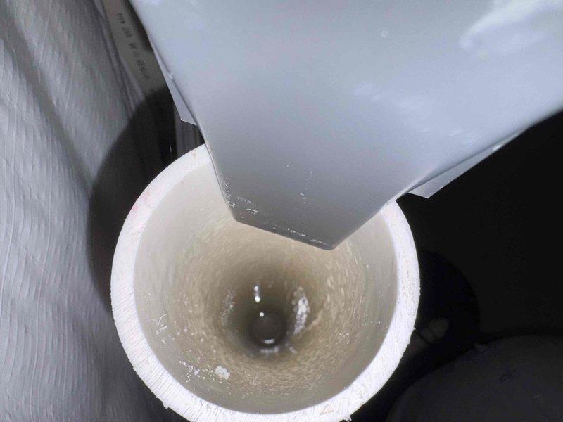 Responded to customer complaint of odor and gurgling noise from floor drain. Upon inspection, identified dry trap condition in floor drain assembly allowing sewer gases to enter living space. Poured water into floor drain to restore proper trap seal, eliminating odor source and resolving gurgling issue caused by negative air pressure in drainage system.