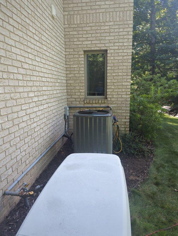 Completed full air conditioning system installation at residential property. Installed new outdoor condensing unit on existing concrete pad with proper refrigerant line connections and electrical hookup. Indoor air handler/furnace system installed in basement mechanical room with integrated ductwork connections, PVC condensate drainage, and proper refrigerant piping. All components tested and verified operational upon completion.