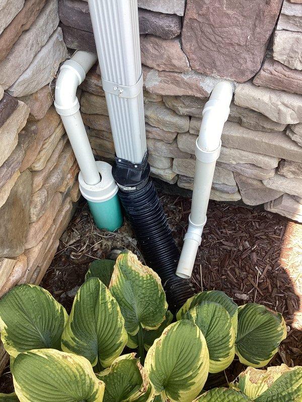 Responded to sump pump discharge issue where water was spraying back into the basement through a failed PVC pipe connection at the sump pit. Upon inspection, identified deteriorated connection fittings on the discharge line that had been leaking for approximately two months. Repaired the compromised PVC connection point at the sump basin, ensuring proper seal and secure fitting to prevent water from re-entering the basement area. Verified discharge line integrity from interior sump pit through exterior termination point at foundation, confirming proper drainage flow away from structure. Tested system operation under full pump cycle to confirm leak elimination and proper water evacuation. Documented existing installation configuration including discharge routing and exterior drainage connection. System restored to full operational status with no further water intrusion into basement area.