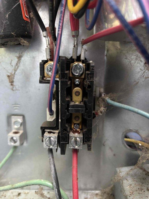 Responded to no cooling complaint on five-year-old EnergiAir system. Upon arrival, confirmed air conditioning unit was not producing cold air and indoor temperature was extremely elevated. Inspected outdoor condensing unit and electrical components, including contactor assembly and associated wiring connections. Documented equipment condition with photos showing contactor, terminal connections, and overall system status for service records.