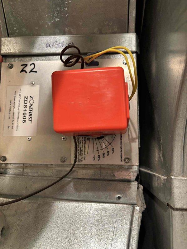 Returned to site to replace failed zone damper motor on HVAC zoning system. Removed defective motor from zone damper assembly and installed new replacement motor, ensuring proper electrical connections to the ZoneFirst ZDS1608 zone control panel. Verified motor operation, confirmed damper movement through full range of motion, and tested system functionality with all zones responding correctly to thermostat calls.