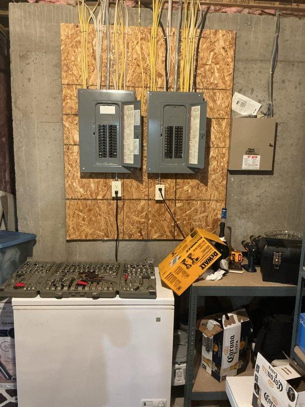 Conducted on-site assessment for standby generator installation estimate. Evaluated existing electrical infrastructure including main service panels, circuit breaker configuration, and available utility space in basement area. Documented current electrical system setup with two main distribution panels and auxiliary disconnect box to determine proper integration points for proposed automatic transfer switch and generator connection. Photographed electrical panel specifications and available installation locations to develop accurate pricing proposal for whole-home backup power system.