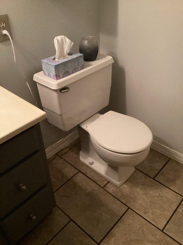 Completed new toilet installation in residential bathroom of 60-year-old home. Removed existing fixture and installed replacement unit, ensuring proper seating, secure floor flange connection, and verified all plumbing connections for leak-free operation. Inspected crawl space beneath bathroom to confirm drain line integrity and proper waste line pitch. Tested flush mechanism and water supply line for proper function upon completion.
