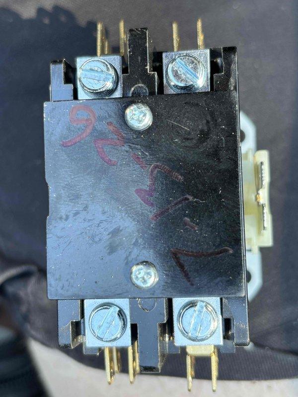 Responded to no cooling condition on six-year-old EnergiAir air conditioning unit displaying system fault code 73. Diagnosed and confirmed failed contactor with shorted contacts preventing compressor operation. Removed defective contactor, verified wiring connections per unit schematic, and installed replacement contactor to restore cooling capability.