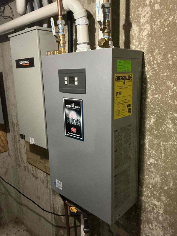 Completed tankless water heater tune-up and descaling service on a Bradford White Infiniti unit that had been in operation for approximately two years. Performed full system flush and descaling procedure using pump and collection buckets to circulate descaling solution through the heat exchanger, removing mineral buildup and scale deposits to restore optimal efficiency and performance. Unit tested and returned to normal operation following the maintenance procedure.
