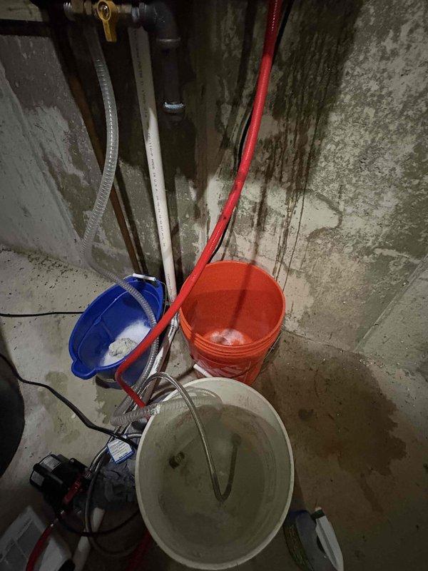 Completed tankless water heater tune-up and descaling service on a Bradford White Infiniti unit that had been in operation for approximately two years. Performed full system flush and descaling procedure using pump and collection buckets to circulate descaling solution through the heat exchanger, removing mineral buildup and scale deposits to restore optimal efficiency and performance. Unit tested and returned to normal operation following the maintenance procedure.