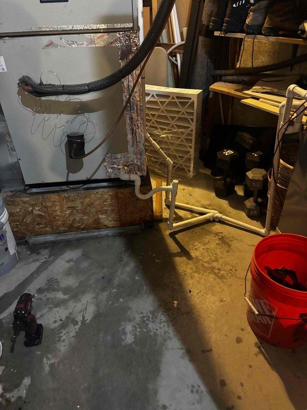 Responded to cooling complaint on 7-year-old Goodman heat pump system. Upon arrival, found significant water pooling on basement floor near air handler unit, indicating condensate drainage issue. Inspected condensate drain system and identified blockage in PVC drain line preventing proper water evacuation. Cleared obstruction from condensate piping and verified proper drainage flow. Checked air filter condition and found adequate airflow through return system. Tested system operation in cooling mode and confirmed unit cycling properly with adequate cooling capacity. System returned to normal operation with resolved drainage issue.