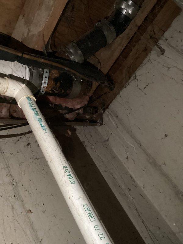 Conducted comprehensive site assessment for gas line installation project at residential property. Documented existing exterior gas meter assembly mounted on brick facade with current piping configuration, including evaluation of placement relative to landscaping and structural elements. Inspected interior mechanical systems in basement crawl space, identifying aging plumbing infrastructure with significant corrosion on existing valves and fittings near pump assembly. Provided detailed photographic documentation of both exterior gas service entry point and interior utility connections to develop accurate project estimate for gas line installation and potential replacement of deteriorated components.