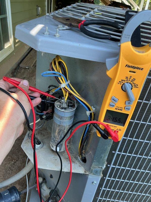 Completed comprehensive Super Tune-up service on 10-year-old residential air conditioning system. Performed electrical diagnostics using Fieldpiece multimeter, measuring capacitor performance and verifying proper voltage readings at 24.5V across system components. All electrical connections inspected, tested, and confirmed to be functioning within manufacturer specifications with no signs of deterioration or required repairs.