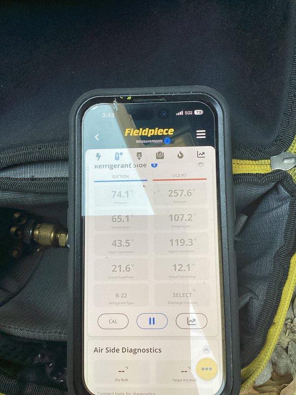 Responded to service call for air conditioning system not cooling. Upon arrival, connected diagnostic equipment to evaluate system performance. Used Fieldpiece digital manifold to measure refrigerant pressures and temperatures on 24-year-old R-22 system. Diagnostic readings revealed system operating parameters including superheat and subcooling values. 

Inspected condensate drainage system in basement area, noting flexible corrugated drain line routing through structural space. Observed significant moisture damage and deterioration on basement walls with paint peeling and water staining, indicating possible long-term drainage or moisture issues in the area. Documented equipment readings and site conditions with photographs for service records.

Completed diagnostic evaluation and provided customer with findings regarding cooling system performance. Also discussed customer's additional request for chimney cap installation estimate as separate scope of work.