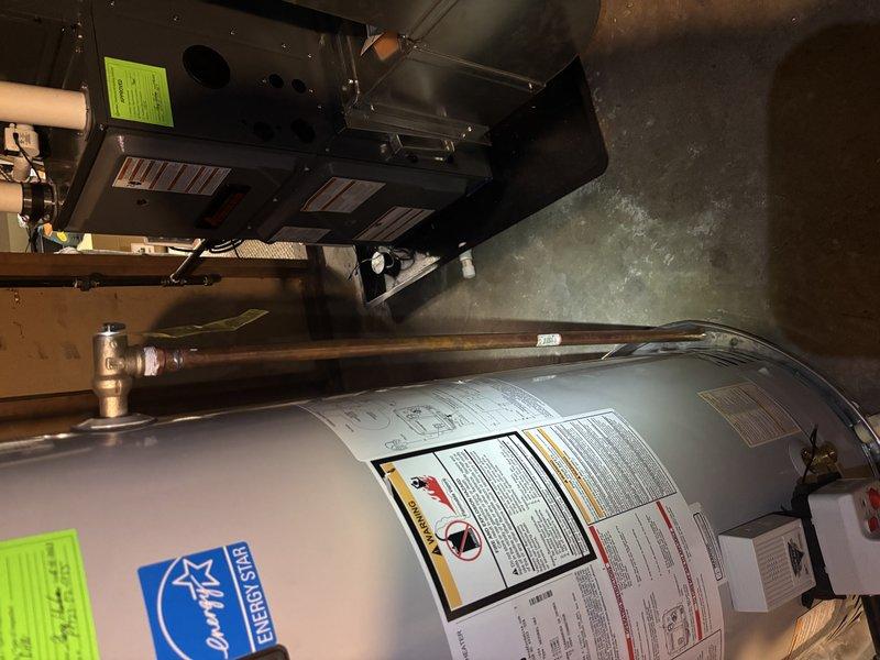 Completed pressure and temperature relief valve replacement and electric anode rod installation on a Bradford White WT 04-2029 water heater. Both components were successfully replaced per manufacturer specifications to ensure proper safety operation and extend tank longevity. Unit tested and verified operational upon completion.