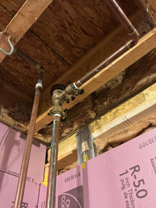Completed annual cooling maintenance on residential HVAC system located in basement utility area. Performed comprehensive inspection of furnace unit, ductwork connections, and associated mechanical components. All copper piping, valves, and connections inspected and found to be in proper working condition. System operating within normal parameters with no issues identified during service visit.