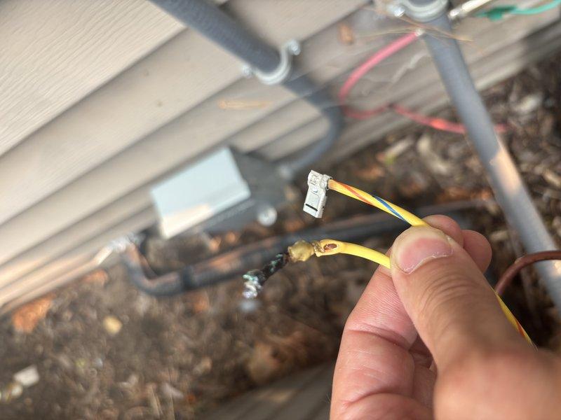 Responded to no cooling complaint on 2022 EnergiAir WT 12-2034 unit. Upon inspection, discovered failed low voltage wire connection preventing proper communication between thermostat and outdoor unit. Replaced defective yellow control wire with new connector ends, restored electrical continuity to control circuit, and verified all wire connections secure within junction box. System tested and confirmed cooling operation restored to normal parameters.