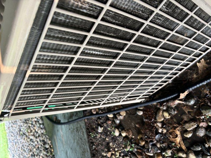 # ASTU-AC Super Tune-Up Completed

Performed comprehensive super tune-up service on 32-year-old YORK air conditioning system experiencing reduced cooling capacity during high ambient temperatures. Upon inspection, discovered significant accumulation of dirt, dust, and debris on condenser coil fins, severely restricting airflow and reducing heat transfer efficiency.

Completed full system evaluation including electrical connections, refrigerant pressures, and overall component condition. Thoroughly cleaned condenser coil using appropriate methods to remove heavy buildup from fins and restore proper airflow through heat exchanger. Verified protective grille and cabinet integrity remained intact throughout service.

System operational testing confirmed improved performance following cleaning and tune-up procedures. Provided homeowner with maintenance recommendations to optimize efficiency and extend equipment lifespan given the advanced age of the unit.
