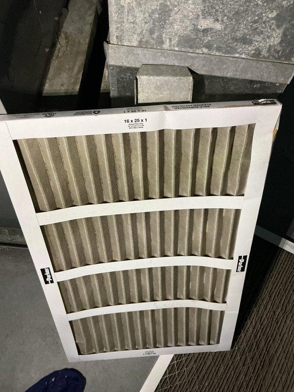 Responded to no cooling call on 24-year-old American Standard system. Upon inspection, found outdoor condensing unit heavily obstructed with leaves, twigs, and organic debris accumulating around and within the unit compartment. Debris buildup was restricting airflow to the condenser coil and compromising system performance. Cleaned condensing unit area, removing all accumulated debris from compartment and surrounding components. Inspected 16x25x1 air filter at indoor air handler, which showed normal wear. Cleared all obstructions from outdoor unit, restored proper airflow to condenser coil, and verified system operation. Unit returned to normal cooling function after debris removal.