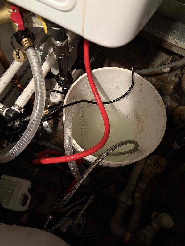 Completed yearly maintenance on wall-mounted Navien tankless water heater with no reported issues. Performed comprehensive tune-up including inspection of all plumbing connections, gas lines, venting system, and electrical components. Flushed unit to remove mineral buildup, verified proper operation of all valves and safety devices, checked combustion chamber and heat exchanger, and confirmed adequate venting through PVC exhaust pipe. Unit tested and operating within manufacturer specifications upon completion.