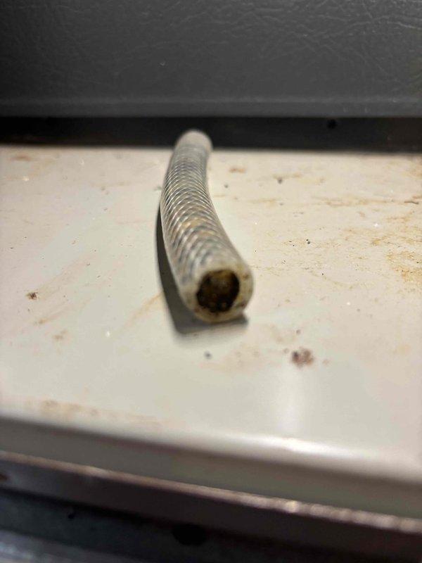 Responded to complaint of intermittent cooling failure affecting entire home after approximately one hour of operation on seven-year-old EnergiAir system. Previous technician visit found unit operational at time of inspection. Upon arrival, confirmed best contact number and proceeded with comprehensive system evaluation. Inspected condensate drain system and discovered failed drain float switch causing safety shutdown when triggered. Removed defective threaded rod-style float switch assembly from drain line. Examined PVC condensate piping, drain pan connections, and associated safety components in mechanical space. Replaced faulty float switch with new assembly to restore proper condensate overflow protection. Verified drain line flow, tested system operation through multiple cooling cycles exceeding one hour to confirm intermittent shutdown issue resolved. Unit now cooling properly without safety interruptions.