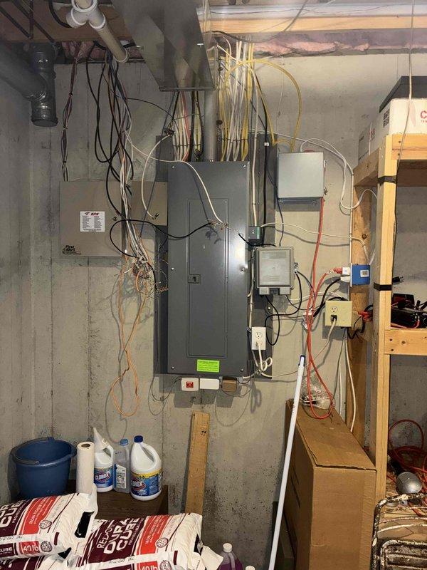 Conducted comprehensive site assessment for whole home generator installation at a 24-year-old residential property with no existing backup power system. Evaluated basement electrical infrastructure, including main service panel, existing electrical loads, and available installation space. Documented current utility room configuration with water heater, electrical distribution equipment, and existing conduit pathways to determine optimal generator placement and transfer switch location. Assessed concrete wall mounting options and overhead clearances for required electrical connections and automatic transfer switch installation.