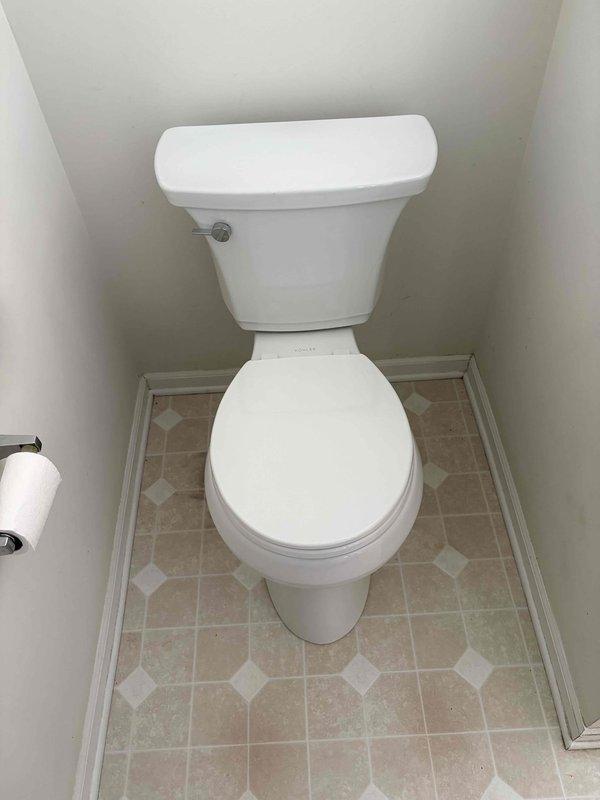 Responded to a request for toilet replacement estimate. Inspected two existing toilets to assess replacement requirements. Documented current conditions with photographs showing a standard two-piece white toilet with Fluidmaster fill valve assembly in good working condition. The bathroom features diagonal beige and tan tile flooring with white diamond accents. Provided estimate for complete toilet replacement service including removal of existing fixtures and installation of new units.